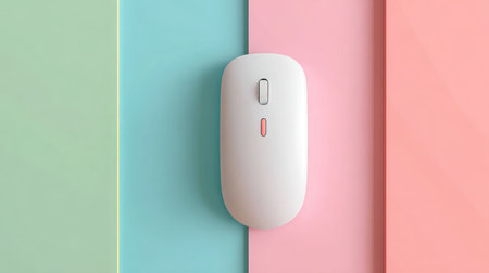 Colorful wireless mouse placed on pastel-colored flat surface backgroundの素材