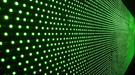 Green LED light pattern glowing against a dark tech-themed backdropの素材