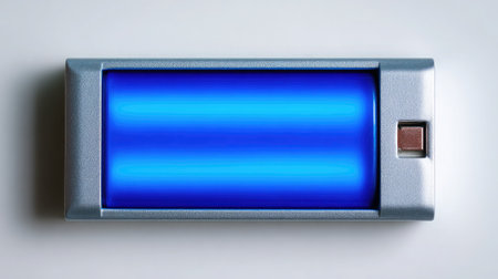 Flat smartphone battery placed flat and centered on white with smooth lightingの素材