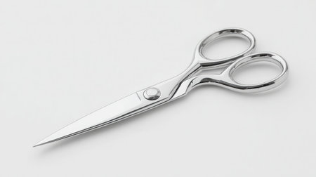 Minimalist image of scissors with narrow tip and sleek handle design, isolated on whiteの素材
