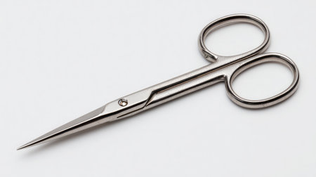 Narrow-blade mustache scissors cleanly displayed on a seamless white backdropの素材