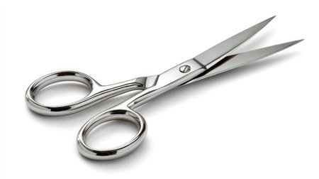 Open grooming scissors showcasing cutting precision, laid on white backgroundの素材