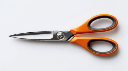 Scissors with protective rubber grips arranged on white background for clean product layoutの素材