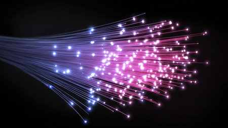 Glowing fiber optic cables symbolize fast digital communication and high-speed dataの素材