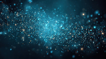 Experience the mesmerizing beauty of cosmic sparkles and brilliant light particles in this stunning deep space imagery, showcasing enchanting hues of blue and turquoise.の素材
