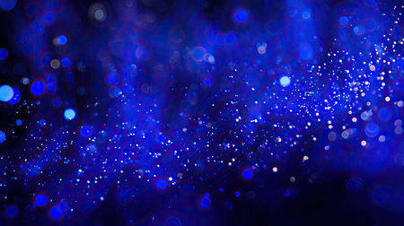An enchanting blue background filled with glowing particles and a captivating bokeh effect, perfect for abstract designs and artistic creations. This image evokes a sense of magic and creativity.の素材
