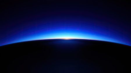 This captivating image captures the serene horizon at twilight above Earth, showcasing a stunning gradient of deep blue tones blended with subtle light.の素材