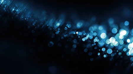 This captivating abstract blue bokeh background features a stunning array of light effects and sparkles, ideal for creative projects and designs.の素材