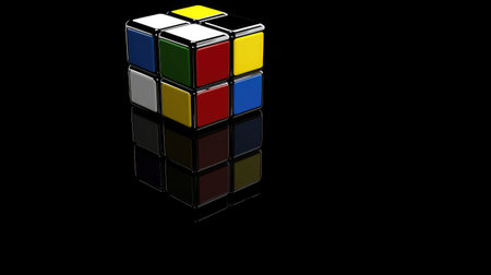 A Rubik's cube with one face completed, representing solving complex business strategy puzzlesの素材