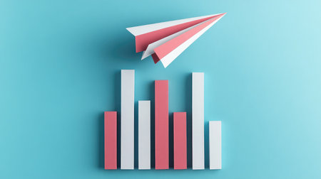 A paper airplane soaring above bar charts, representing innovative approaches to business growthの素材
