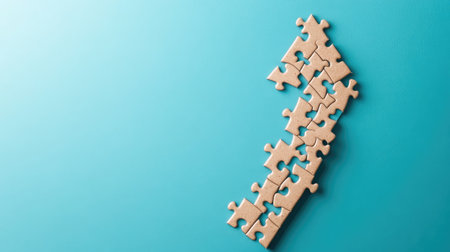 A jigsaw puzzle forming an upward arrow, illustrating pieces coming together to achieve growthの素材