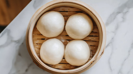 A top-down shot of a bamboo basket filled with fluffy char siu bao BBQ pork buns.の素材
