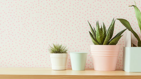 Brighten your living space with this image of vibrant indoor plants in stylish pots, set against soft pink wallpaper, creating a fresh, cozy atmosphere.の素材