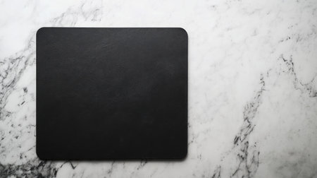 A stylish black leather mouse pad positioned on a white marble surface, ideal for enhancing any workspace or home office with a sleek and modern aesthetic.の素材