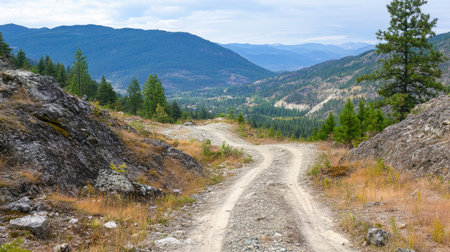 A serene mountain path winds through a stunning natural landscape, showcasing the beauty of nature and inviting exploration into the great outdoors.の素材