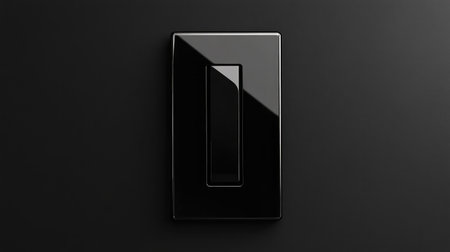 A sleek, glossy black light switch mounted on a dark wall, showcasing minimalist elegance and modern design, ideal for contemporary interior spaces.の素材