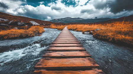 Rustic wooden plank footpath across a mountain streamの素材