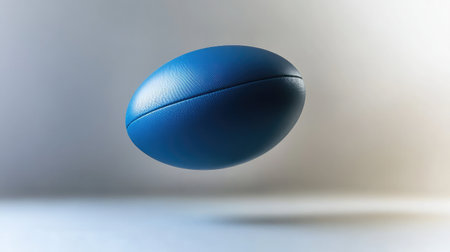 A slow-motion capture of a rugby ball rotating in the air.の素材