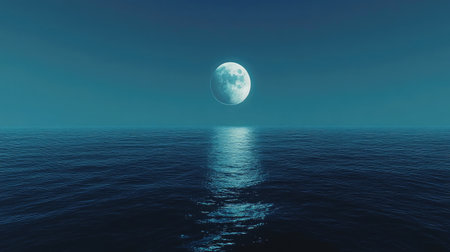 A peaceful view of a distant moon rising over the surface of an alien ocean.の素材