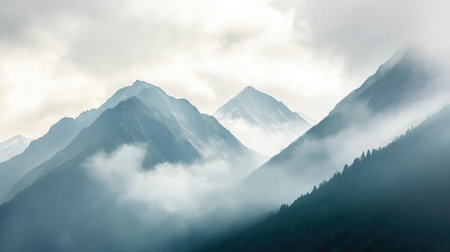 A misty mountain range with layers of peaks fading into the horizon.の素材