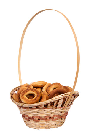 Basket with dry bread-ring  isolated on white backgroundの写真素材
