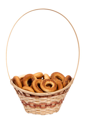 Basket with dry bread-ring  isolated on white backgroundの写真素材