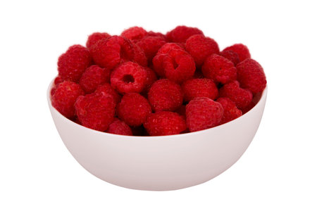 Cup with raspberries isolated on white background