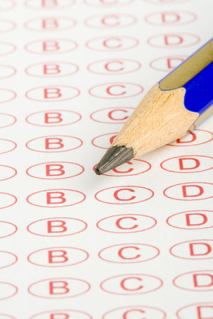 A close up of an answer sheet for a test with a pencil