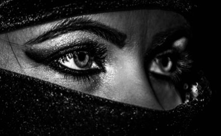 eyes of an oriental woman in a burqa, close-upの写真素材