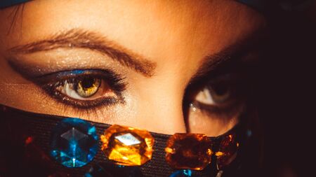 eyes of an oriental woman in a burqa, close-upの写真素材