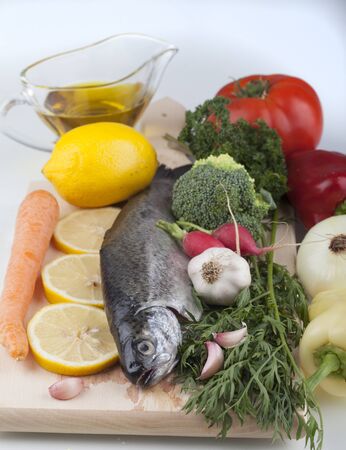 fresh trout on a cutting boardの写真素材