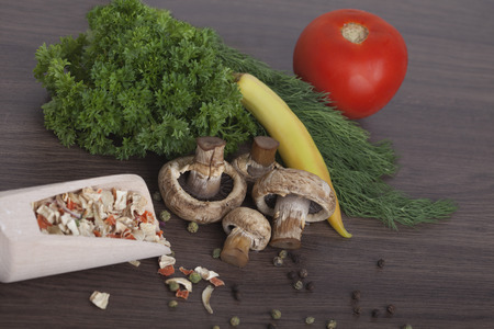 mushrooms with vegetables on a wooden backgroundの写真素材