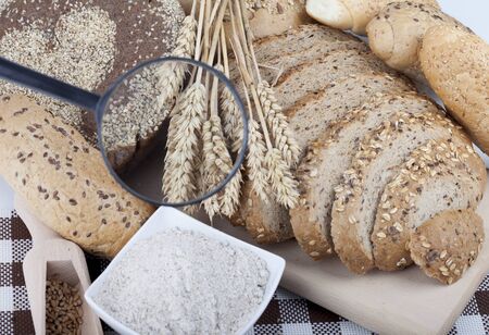 fresh bread and wheat on the woodenの写真素材