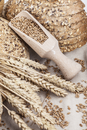 fresh bread and wheat on the woodenの写真素材