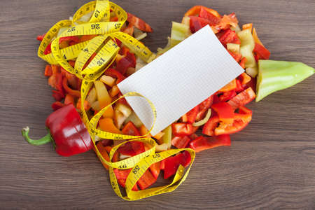 Heart shape chopped peppers on a wooden backgroundの写真素材