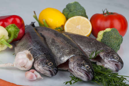 fresh trout on a cutting boardの写真素材