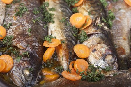 Fish dish - fried trout with vegetablesの写真素材