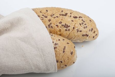 fresh bread and wheat on the woodenの写真素材