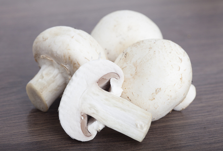 fresh champignon on wooden backgroundの写真素材