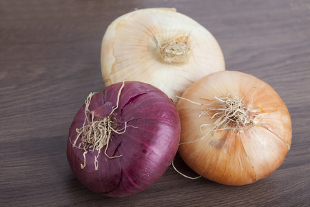 Fresh Onions on a wooden backgroundの写真素材