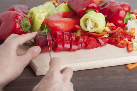 Cook is chopping bell pepper, closeup shootの写真素材