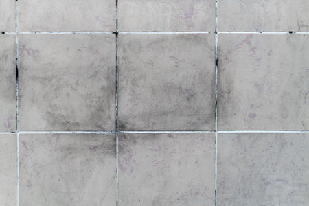 perfect dirty tiles background in underground style with purple and black texture to be used as a screensaver or to support specific authentic and realistic designの写真素材