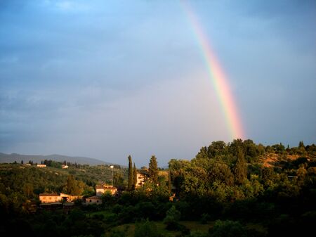 Raimbow on a Tuscan country village after the stormの写真素材