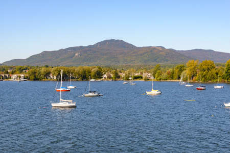 Boats moored on the shore of Lake Maggiore, Italyの写真素材
