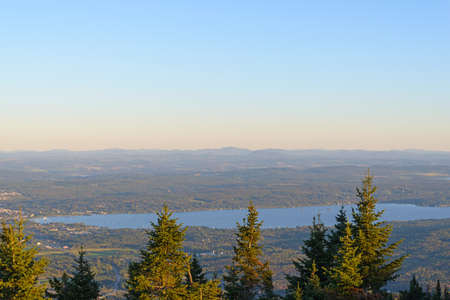 View of the lake from the top of the mountain in the eveningの写真素材