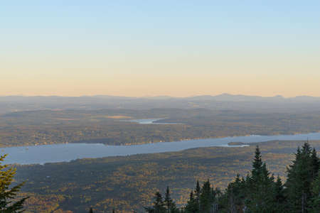 Sunset in the mountains. Autumn landscape. View of the lake and forest.の写真素材