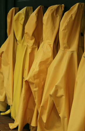 yellow    rain proof jackets hung upの写真素材