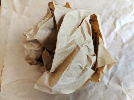 Crumpled brown wax paper wrapper in a ballの写真素材