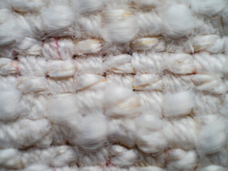 Close up of white woven textured fabric