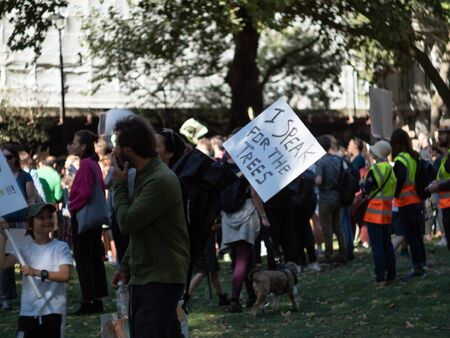 LONDON, UK - SEPTEMBER 20 2019: Handwritten sign reads I speak for the trees, among the crowd at the Global Climate Strike in Londonのeditorial素材